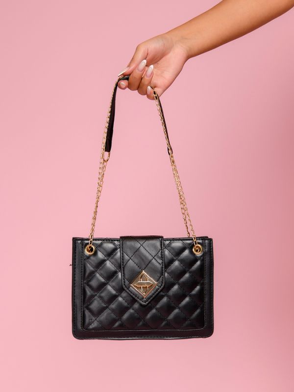 Black quilted bag with a combined strap